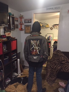 youth male in patched levi jacket